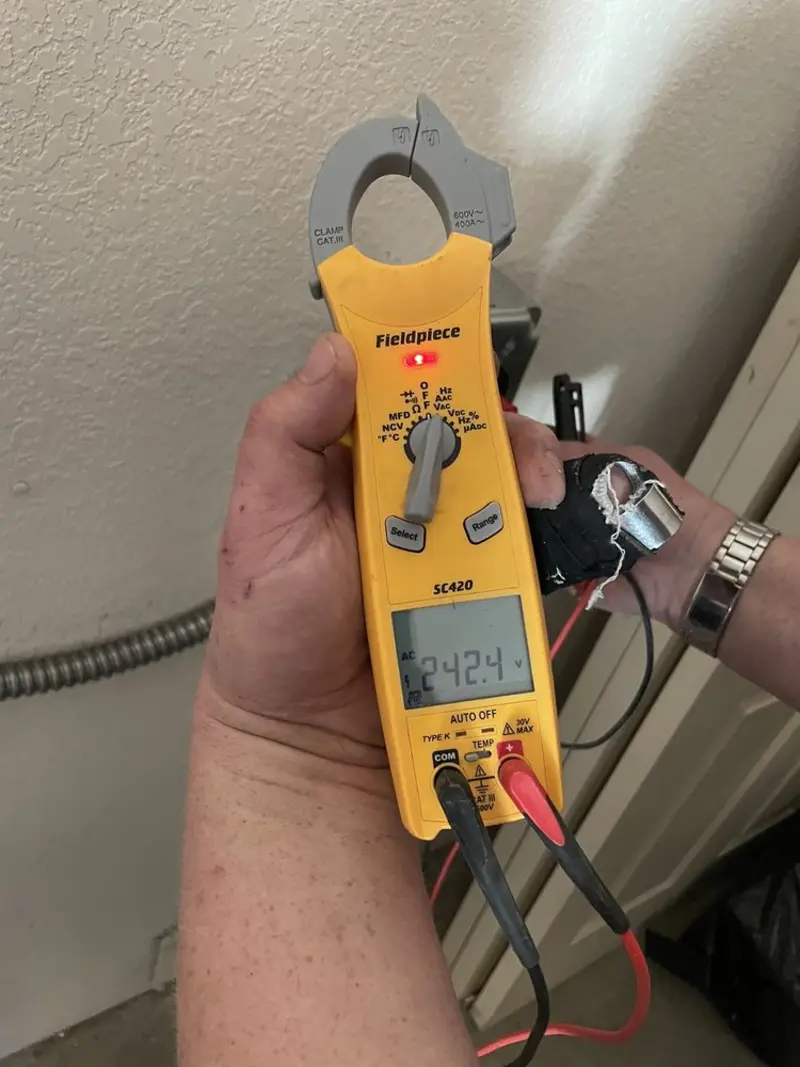 Voltage testing with clamp meter during Outlet Installation in Corona de Tucson